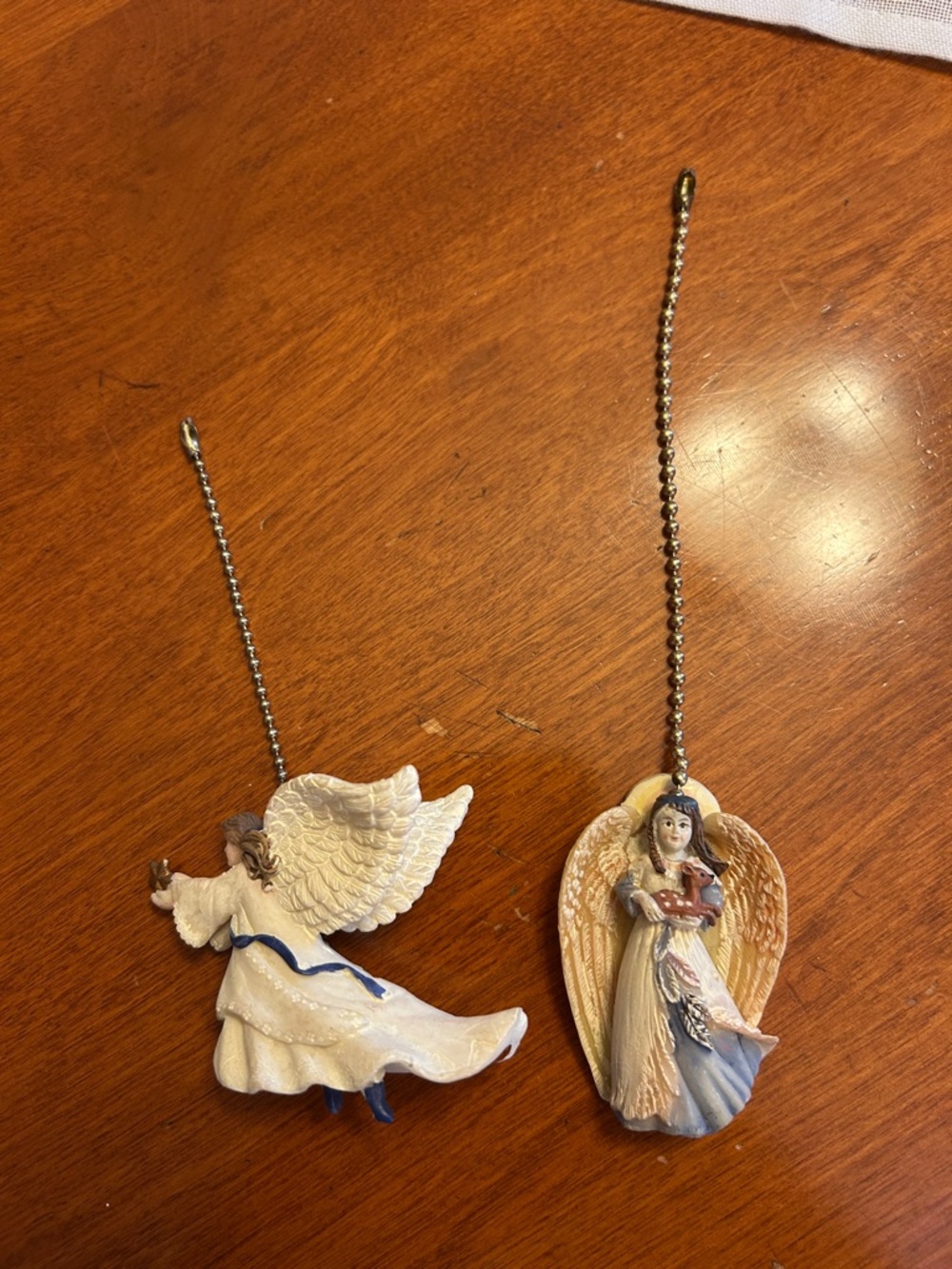 2 beautiful angel fan pulls Resin smoke free pet free home. Like new. Never used